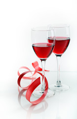 Glass of red wine on a white background and with soft shadow