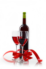bottle with red wine and glass a decorative tape