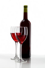 bottle with red wine and glass