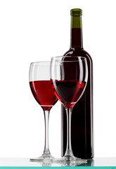 bottle with red wine and glass