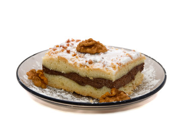 a piece of cottage cheese cake with walnut