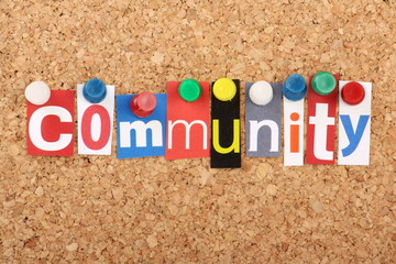 The word Community in magazine letters on a notice board