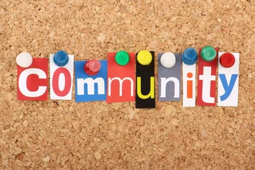 Foto op Plexiglas The word Community in magazine letters on a notice board © thinglass