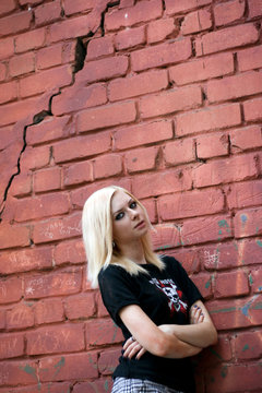Teenager near the brick wall
