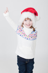 beautiful little girl with Christmas cup