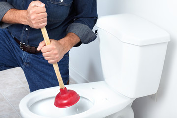 Plumber with a plunger