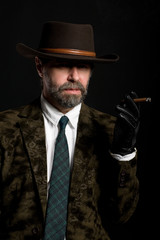 Stylish middle aged man with a cigar.