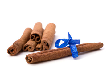 Cinnamon sticks isolated on white background .