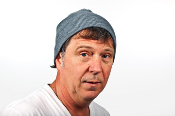 smiling man with winter cap isolated on white