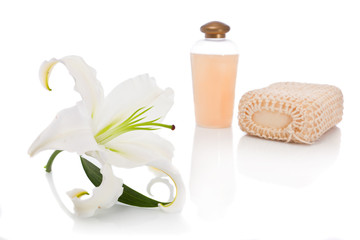 Soap with perfume bottle and lily flower
