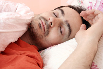 Fototapeta na wymiar Portrait of a young man sleeping.