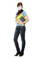 Naklejka premium Young caucasian student woman with mask on her face.