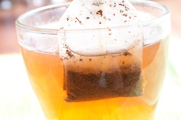 Teabag in the cup with hot water