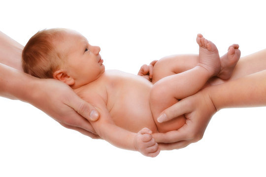 5 days old baby in parents hands