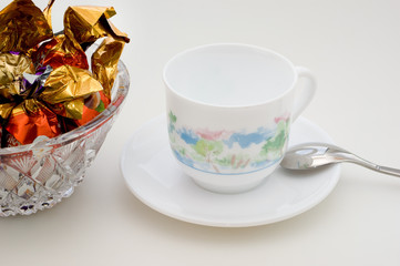 Chocolate candies and cup