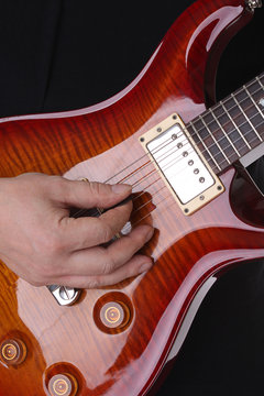 Musician playing guitar - music background
