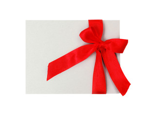 Gift tag with red ribbon isolated