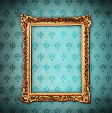 Golden frame over grunge wallpaper