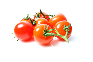 Small tomatoes isolated on white background
