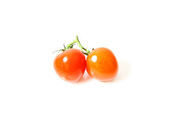 Small tomatoes isolated on white background