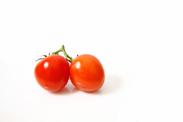 Small tomatoes isolated on white background