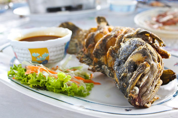 Fried fish with thai spicy seafood sauce.