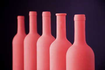 refined bottle with violet background
