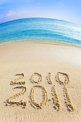 On sand at ocean edge it is written 