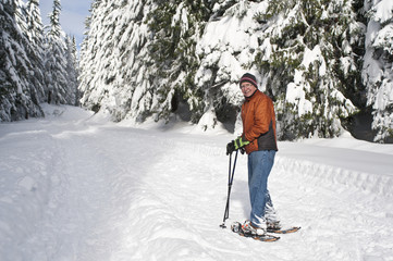 Senior man snowshoeing