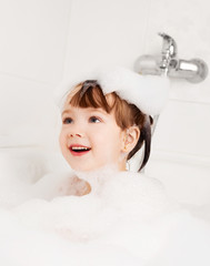 child taking a bath