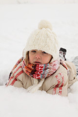 Winter Fun - Girl lying on snow
