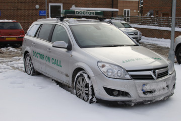 Doctor on call vehicle in snow. England