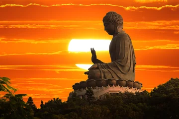 Tuinposter Boeddhabeeld bij zonsondergang © logoboom