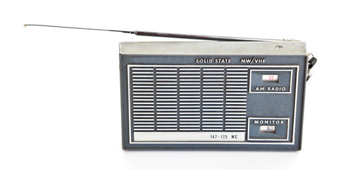 Vintage AM and Police Band Transistor Radio On White Background