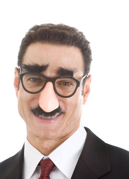 Smiling Businessman Wearing Groucho Marx Glasses Isolated White