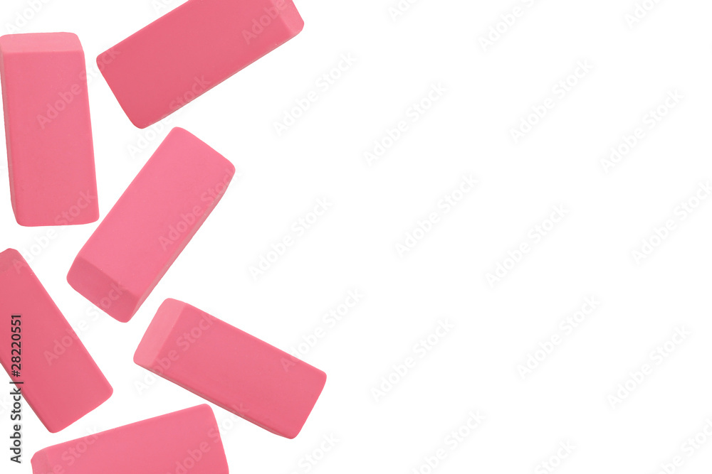 Wall mural pink erasers on white background