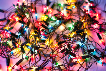 Fototapeta na wymiar Background of colorful Christmas lights. Decorative garland