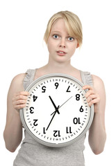 Young blond girl with clock, time concept