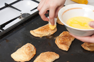 The girl decorates ready pies color sugar balls