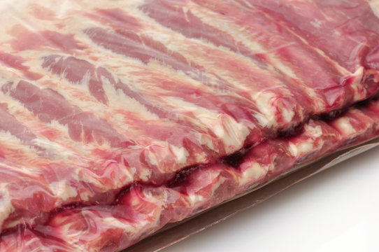 raw ribs in vacuum pacage close up