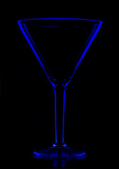 transparent empty martini glass on black
