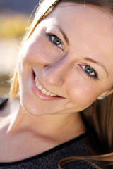 Beautiful young girl smiling. Outdoor portrait