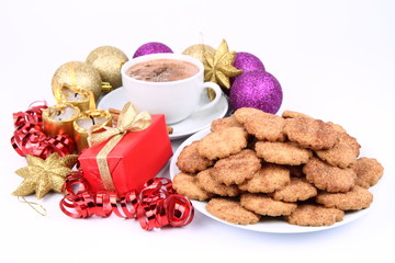 Cup of hot cocoa, cinnamon cookies and christmas decoration