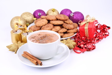 Cup of hot cocoa, cinnamon cookies and christmas decoration