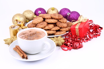 Cup of hot cocoa, cinnamon cookies and christmas decoration