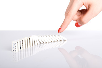 Hand puch the dominoes © Andrei