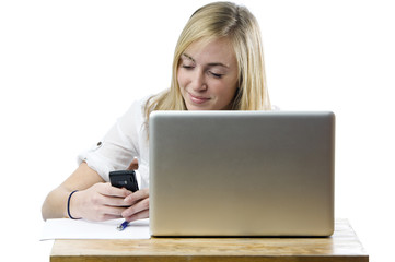 Teenage girl with laptop computer and mobile phone