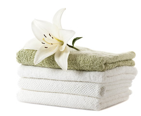 Obraz na płótnie Canvas stack of towels with white lily