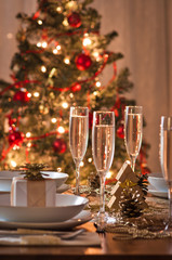 A decorated christmas dining table with champagne glasses - 28264996
