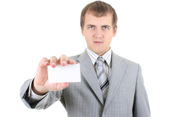 Young businessman showing a blank business card